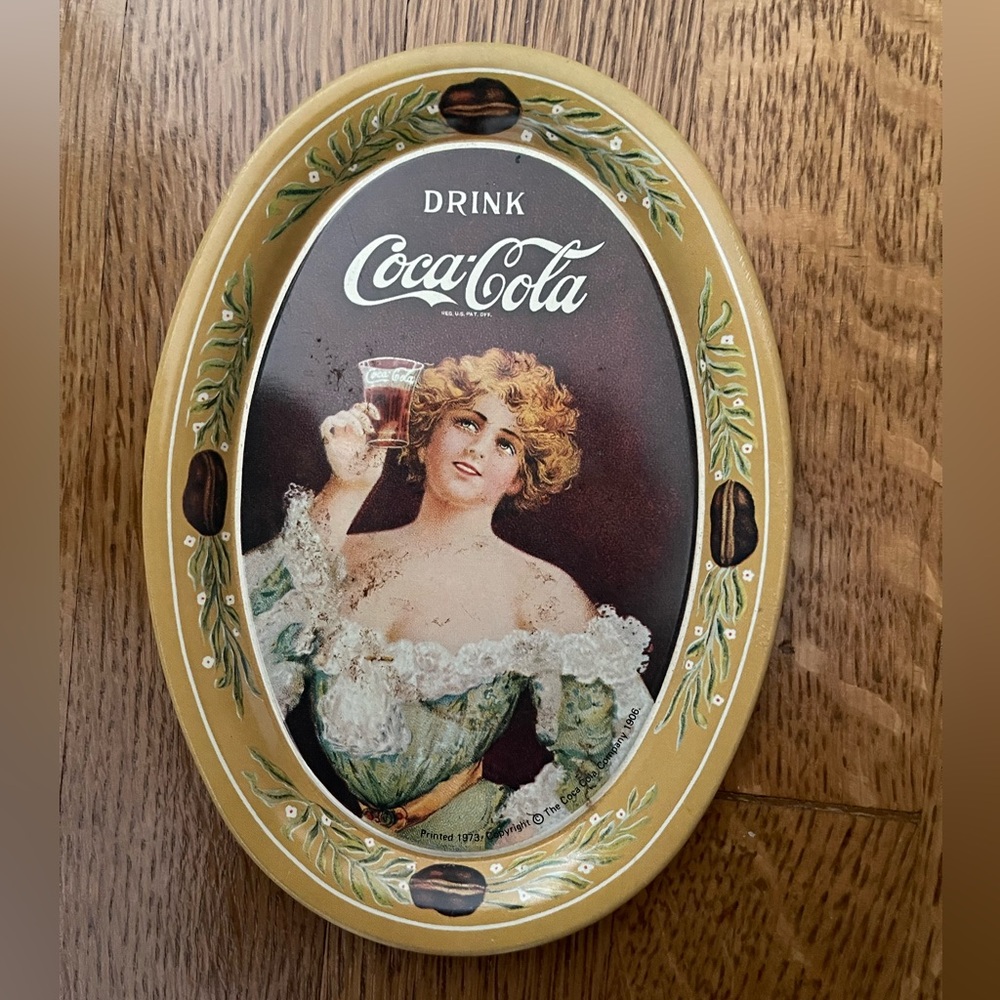 Vintage 1973 Coca Cola Oval Tin Tip Tray 6in x 4.5in. Lady in Dress with Glass.
